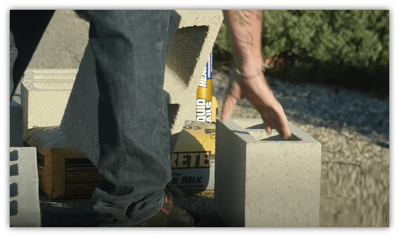 Dad working with cinderblocks