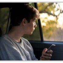 son in the back seat