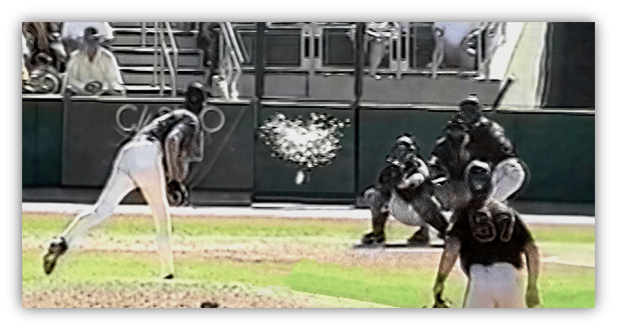 "Baseball pitcher delivering a pitch to a batter during a game."
