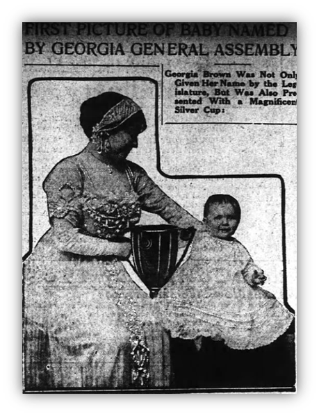 "Historical image of a woman presenting a trophy to a baby named by the Georgia General Assembly."