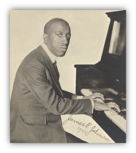 James P. Johnson playing piano, 1921, black and white portrait.