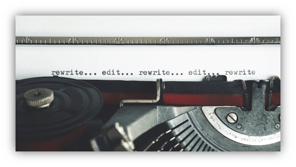 "Close-up of a vintage typewriter with the words 'rewrite... edit...' printed on paper."