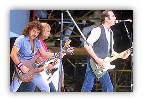 "Rock band performing live on stage with guitars and bass."