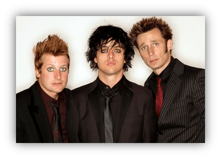 Three musicians in formal attire with distinctive hairstyles and makeup.