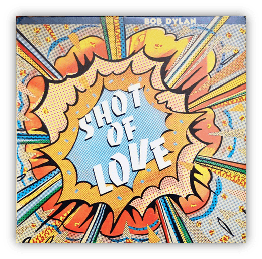 Album cover for Bob Dylan's "Shot of Love" featuring vibrant pop art design and explosive graphics.