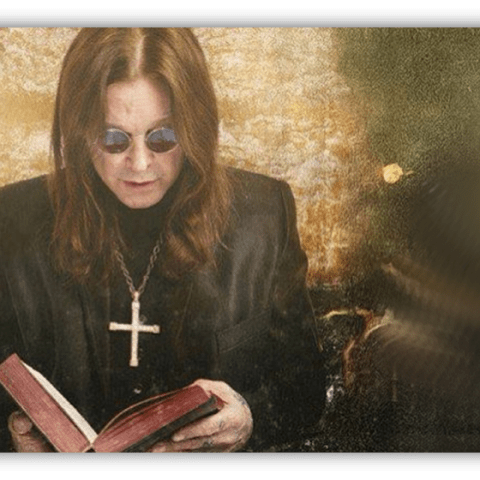 "Person in sunglasses reading a book with a cross necklace, set against a textured background."