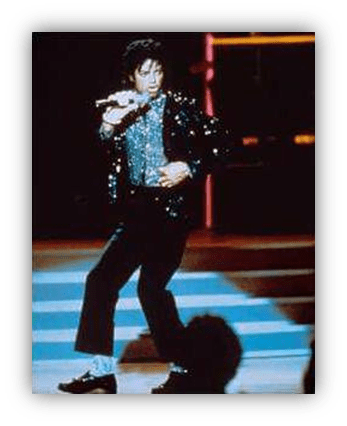 "Michael Jackson performing on stage in a sparkling outfit."