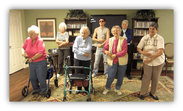 Group of seniors engaging in a fun activity in a community center.