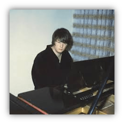 Young musician playing piano in a cozy room.