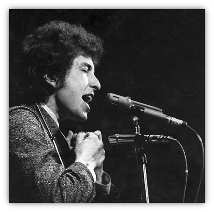 Bob Dylan performing passionately at a microphone.