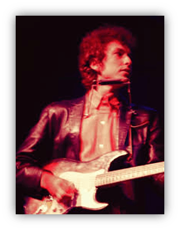 "Musician performing on stage with electric guitar in a leather jacket."