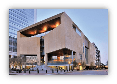 "Modern architectural building with a unique design and large glass windows."