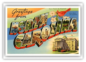 "Vintage postcard greeting from North Carolina featuring state symbols and landmarks."