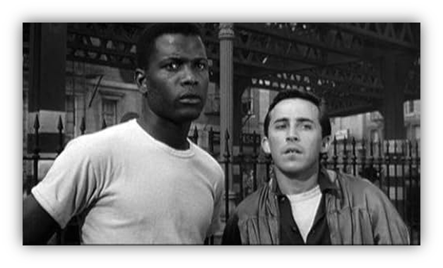 Two men looking concerned in a black-and-white urban setting.