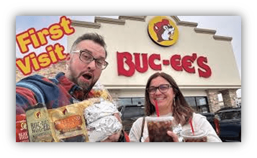 "Couple enjoying their first visit to Buc-ee's, holding snacks and drinks outside the store."