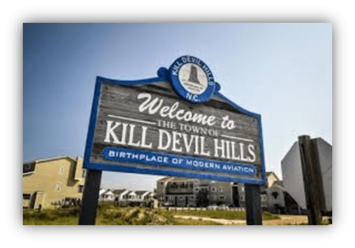 "Welcome sign for Kill Devil Hills, NC, birthplace of modern aviation."