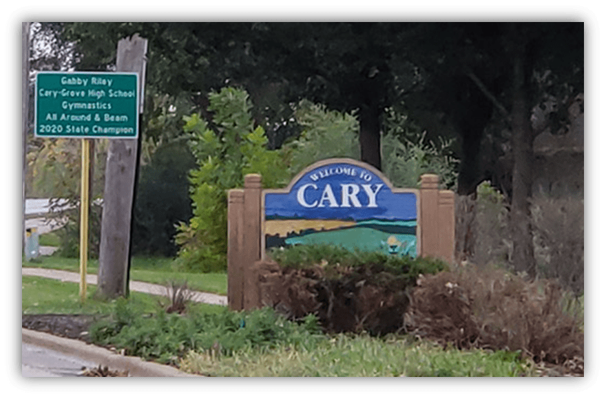"Welcome sign for Cary, Illinois, featuring Gabby Riley's gymnastics achievements."