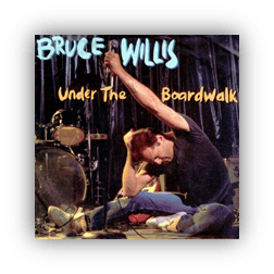 "Album cover of Bruce Willis's 'Under the Boardwalk' featuring him performing on stage."
