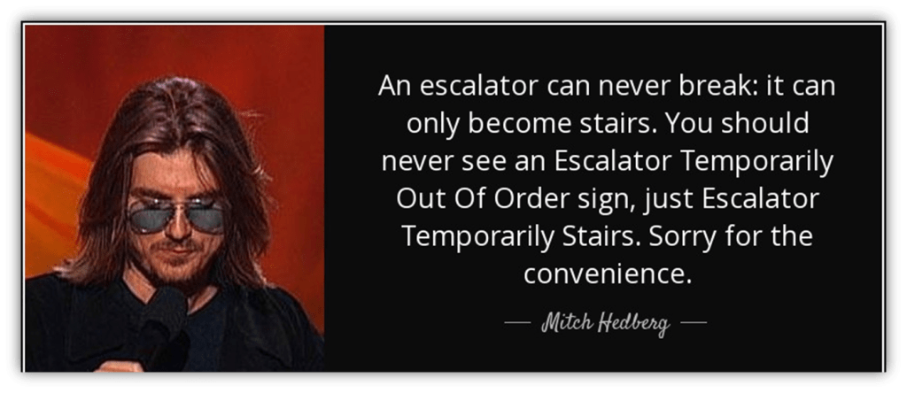 Mitch Hedberg performing stand-up comedy with a humorous quote about escalators.