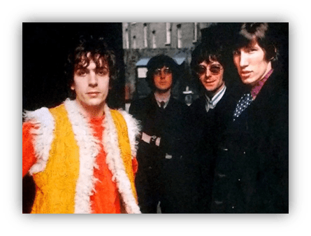 "Iconic 1960s rock band members posing outdoors, featuring colorful outfits and retro style."
