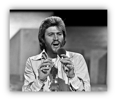 "Black and white photo of a male singer passionately performing with a microphone."
