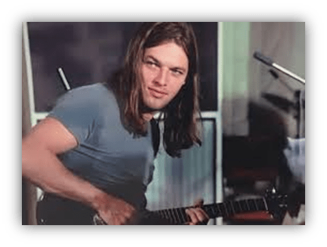 "Young musician playing guitar in a recording studio."
