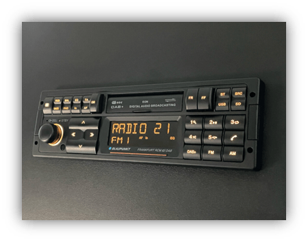"Car radio display with digital audio broadcasting and FM tuning."