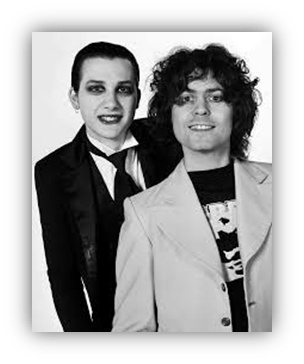 Black and white portrait of two musicians in stylish outfits, showcasing a retro aesthetic.