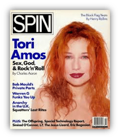 Tori Amos on the cover of Spin magazine, featuring her red hair and bold title "Sex, God, & Rock'n'Roll."