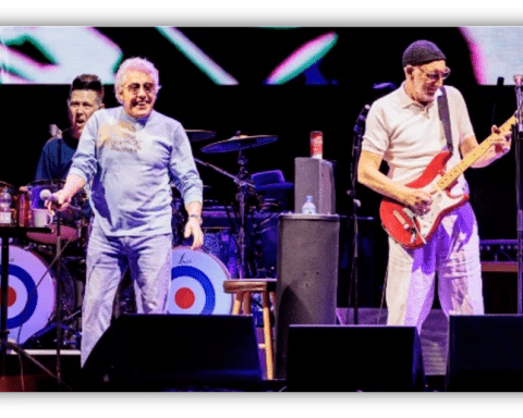 The Who performing live on stage with energetic musicians and vibrant visuals.