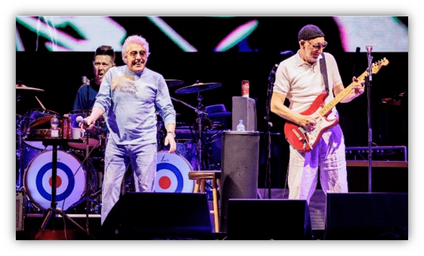 The Who performing live on stage with energetic musicians and vibrant visuals.