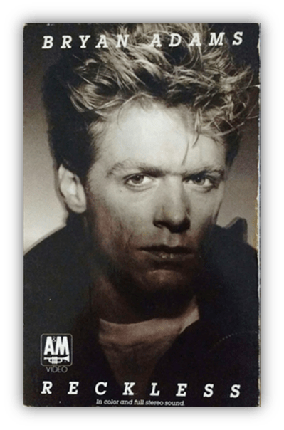 "Bryan Adams Reckless album cover featuring a close-up of the artist."