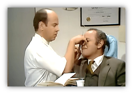 "Doctor examining patient in a humorous medical scene."