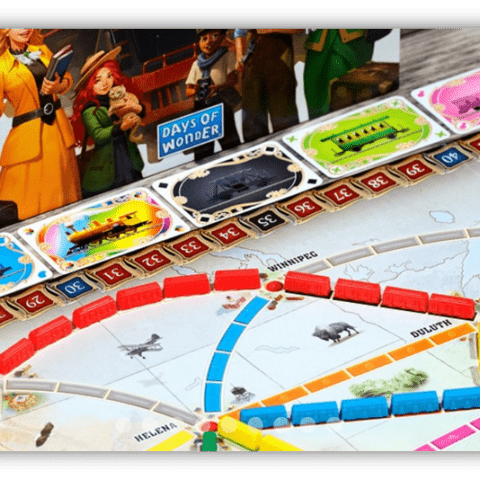 "Close-up of Ticket to Ride board game with colorful train pieces and destination cards."
