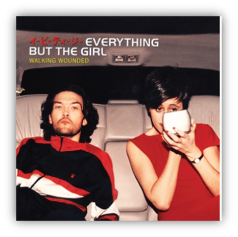"Album cover for 'Walking Wounded' by Everything But The Girl featuring a man and a woman in a car."