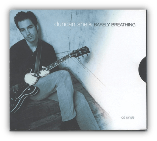 "Album cover of Duncan Sheik's 'Barely Breathing' CD single featuring the artist with a guitar."