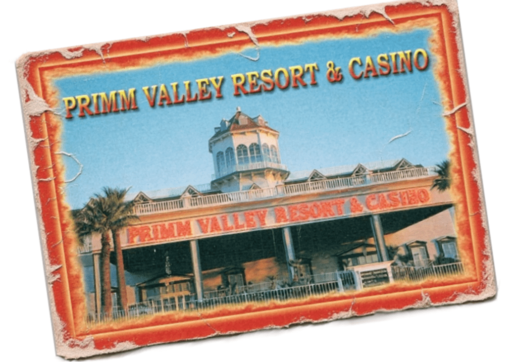 "Primm Valley Resort and Casino exterior view with palm trees."