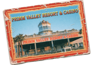 "Primm Valley Resort and Casino exterior view with palm trees."