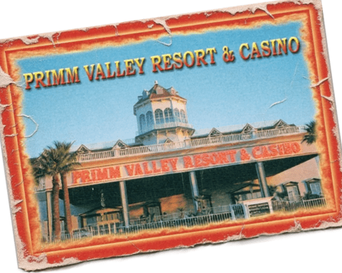 "Primm Valley Resort and Casino exterior view with palm trees."