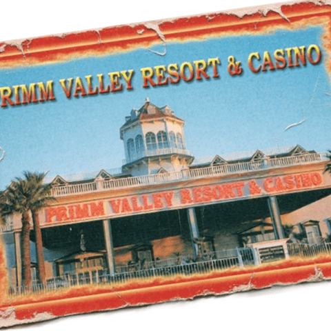 "Primm Valley Resort and Casino exterior view with palm trees."