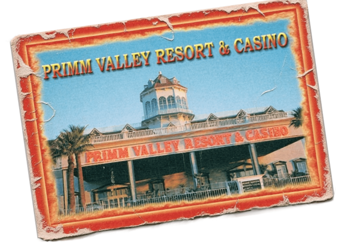 "Primm Valley Resort and Casino exterior view with palm trees."