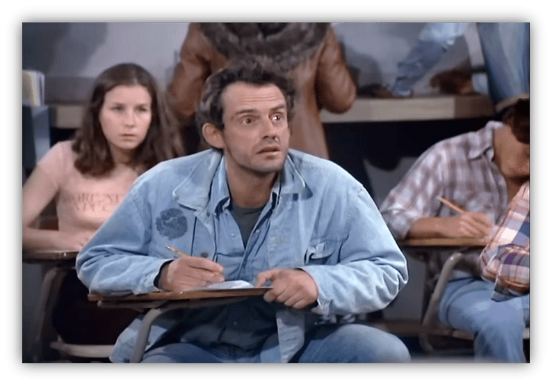 Student looking confused in a classroom setting, taking notes.