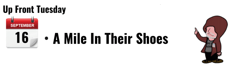 "Calendar marking September 16, event titled 'A Mile In Their Shoes' with cartoon character."