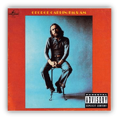 Album cover of George Carlin's "FM & AM" featuring the comedian seated against a blue background.