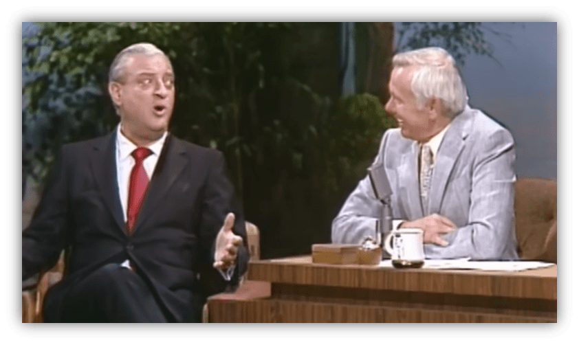 "Rodney Dangerfield performing comedy on The Tonight Show with Johnny Carson."