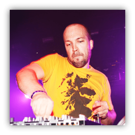 DJ performing live with electronic equipment in a vibrant atmosphere.