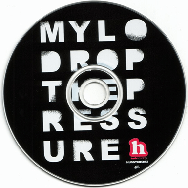 CD cover for Mylo's "Drop the Pressure" featuring bold text on a black background.