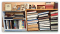 Bookshelves filled with various books, framed photos, and decorative items.