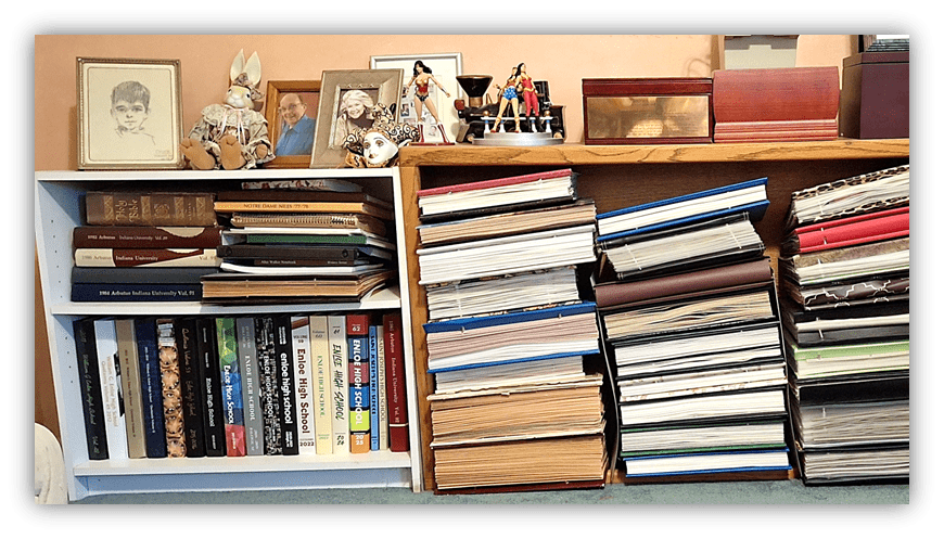 Bookshelves filled with various books, framed photos, and decorative items.