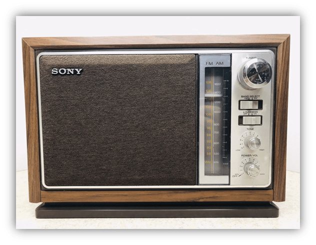 Vintage Sony AM/FM radio with wood finish and analog dial.